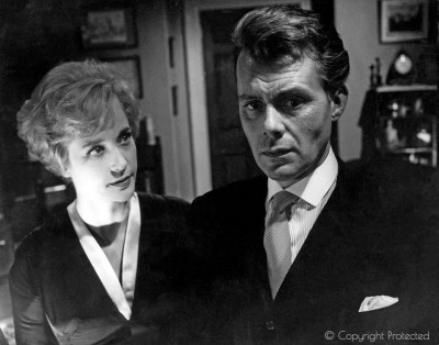 Dirk as Melville Far, with Sylvia Syms, Victim (1961)